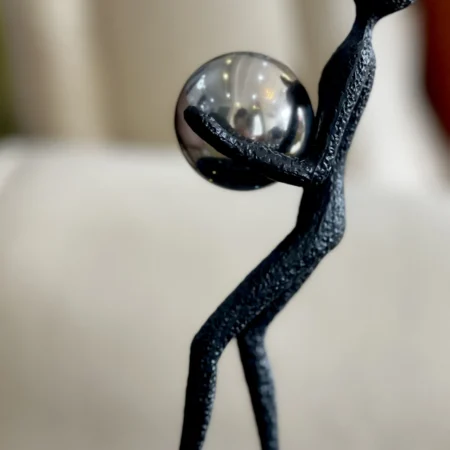 Balance Acrobatic Man Holding A ball